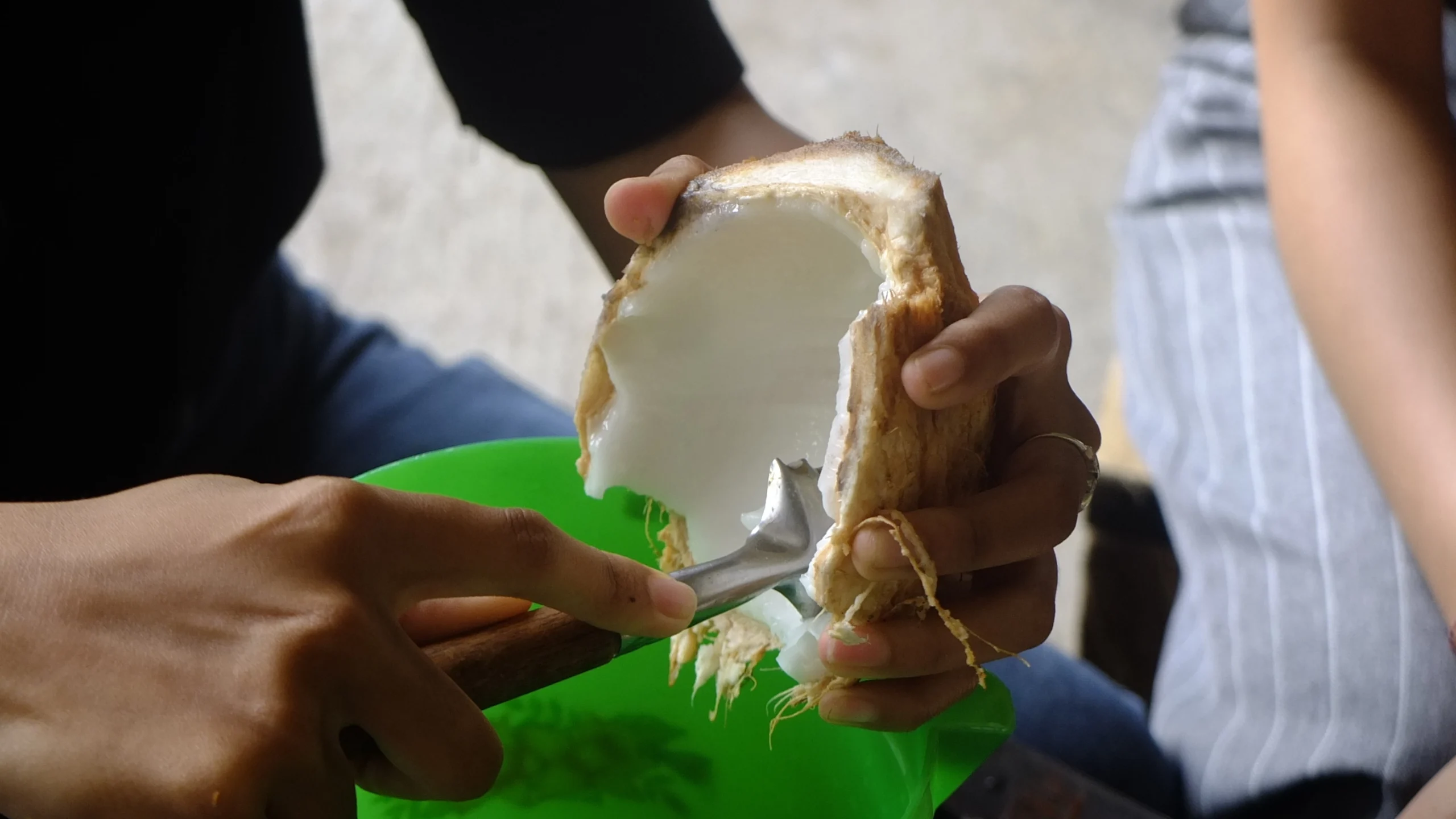 Scraping coconut flesh